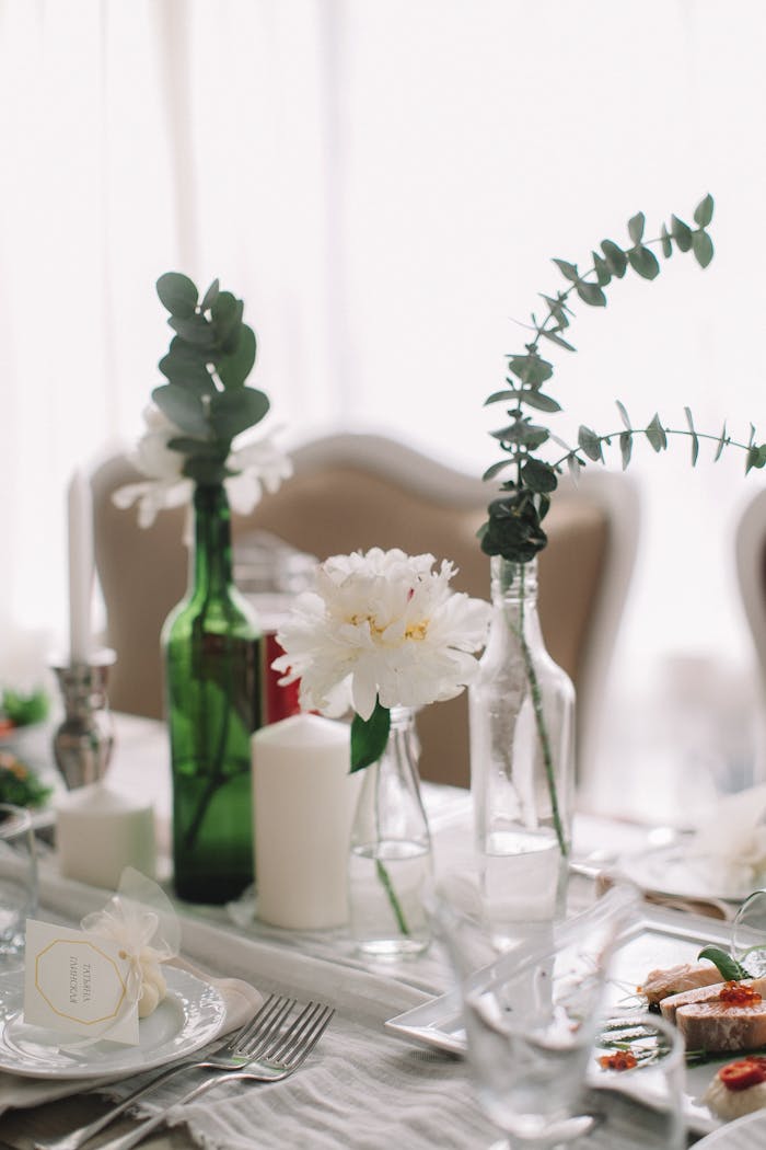 A beautifully arranged dining table with flowers and candles, perfect for elegant gatherings.